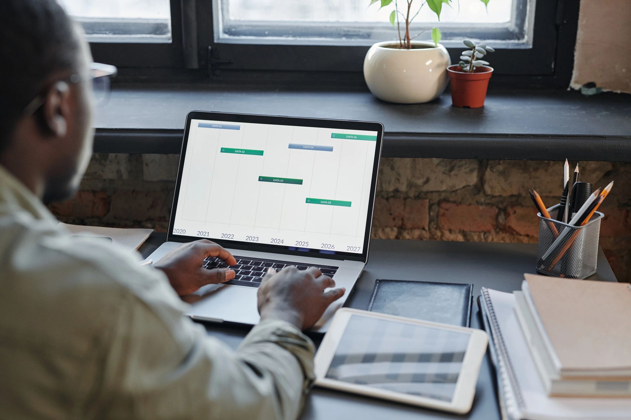 Real estate professional comparing public-profile details during an identity review