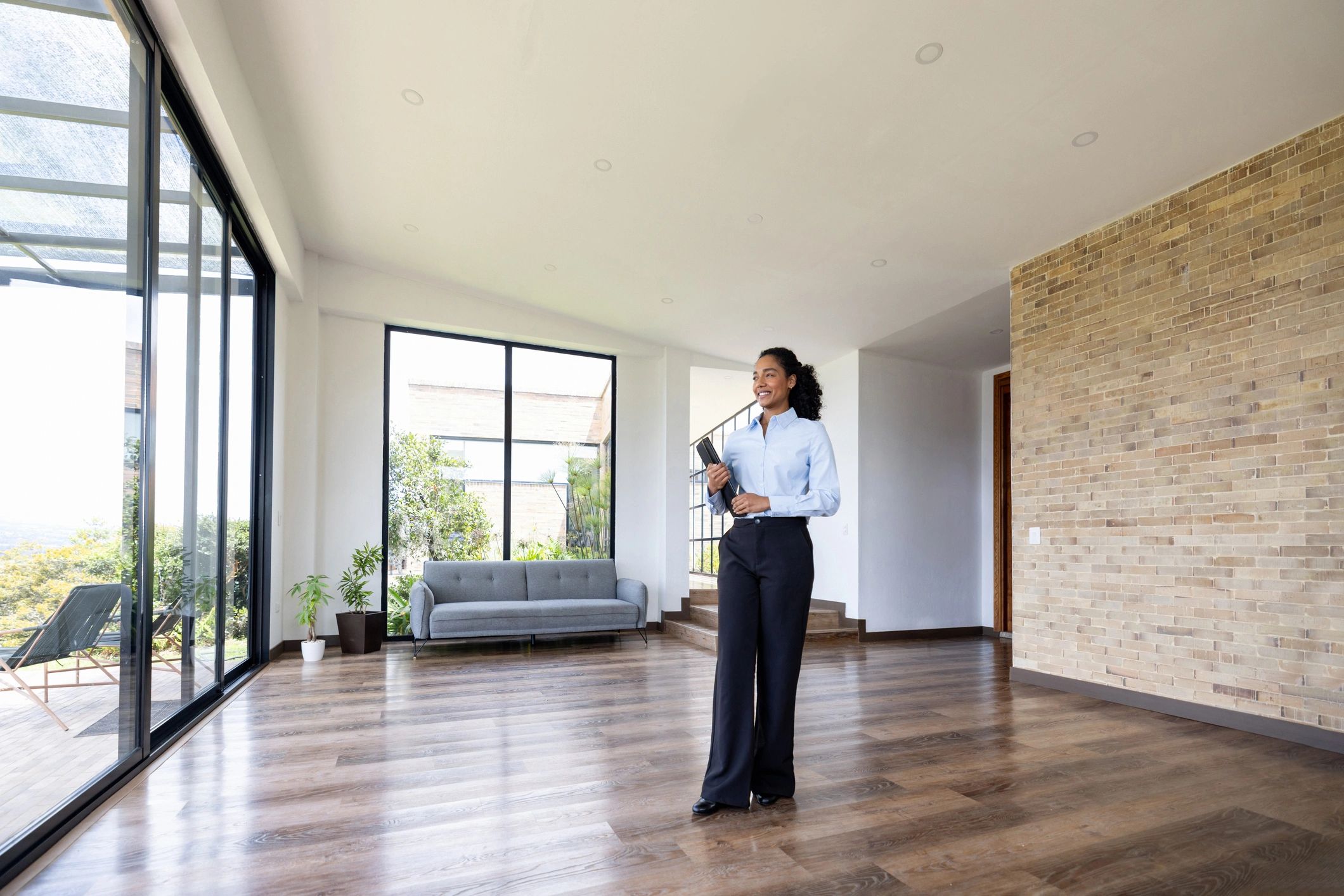 Real estate agent standing in a modern office