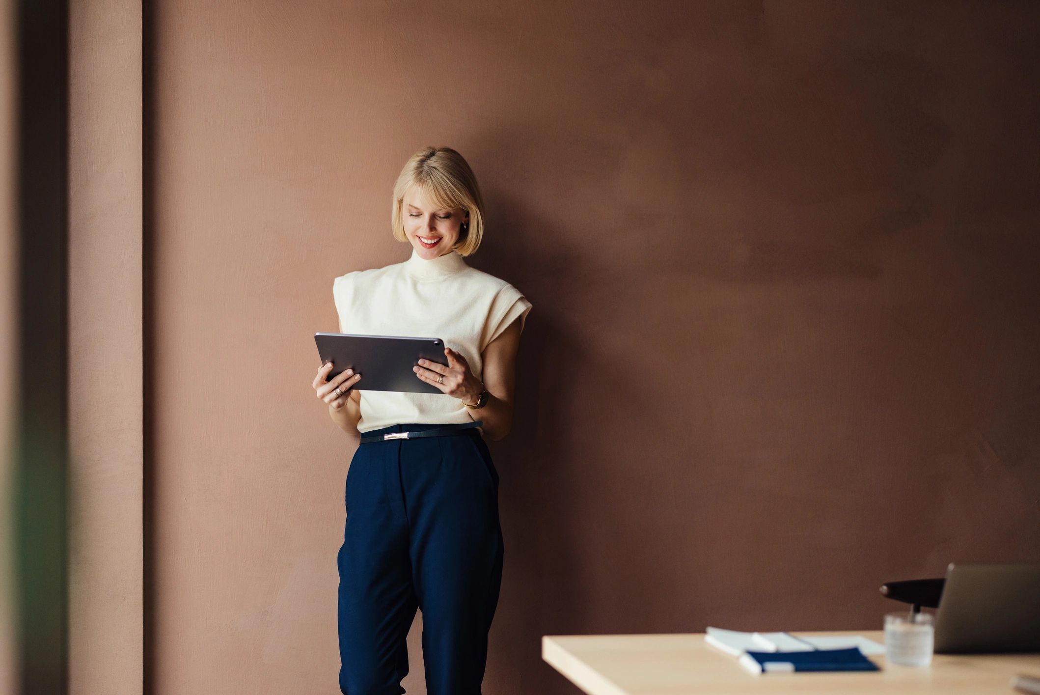 Real estate professional reviewing her public identity on a tablet