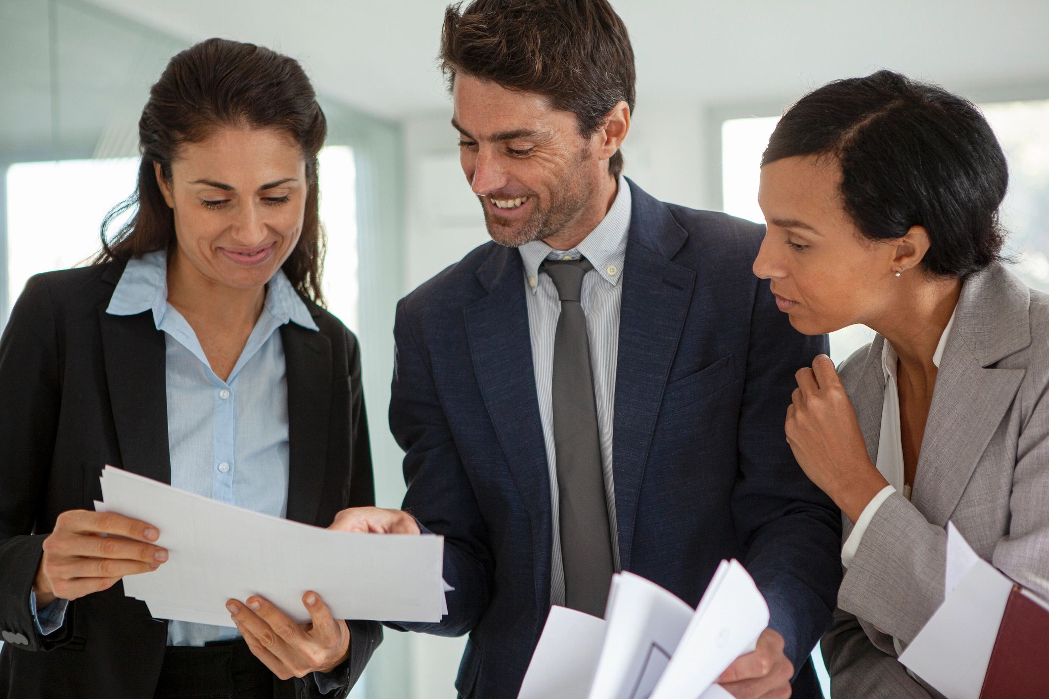 Brokerage leadership team reviewing records for a Brokerage Identity Intelligence Report